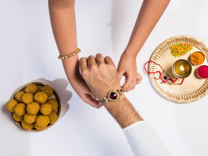 Catchy Raksha Bandhan Captions for Social Media Posts Hyper Content Blog Raksha Bandhan Instagram Post with Siblings and Festive Background