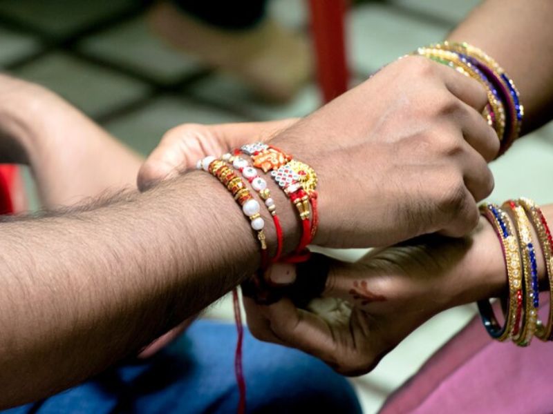 Touching Raksha Bandhan Quotes to Celebrate Sibling Love Hyper Content Blog Handwritten Quote on a Raksha Bandhan Card with Diya and Rakhi