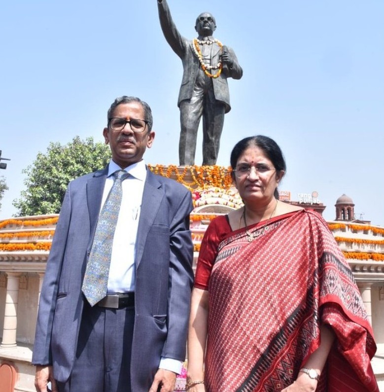 Two People Paying Tribute to Dr BR Ambedkar on Ambedkar Jayanti Hyper Content Blog Two Individuals Standing Respectfully in Front of a Statue of Dr Br Ambedkar During Ambedkar Jayanti Celebrations